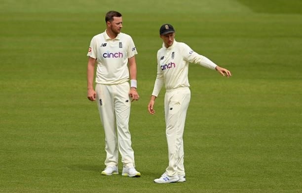 Ollie Robinson and Joe Root of England talk during Day 5 of the First LV= Insurance Test match between England and New Zealand at Lord's Cricket...