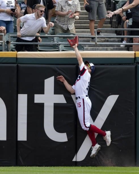 Adam Engle of the Chicago White Sox makes a spectacular catch to rob Niko Goodrum of a home run in the fifth inning against the Detroit Tigers on...