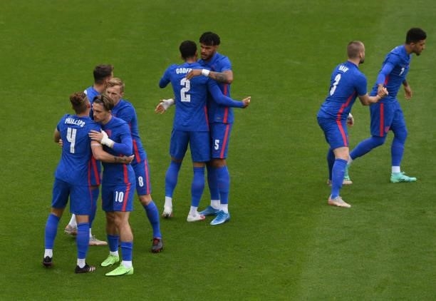 England players embrace before kick off during the international friendly match between England and Romania at Riverside Stadium on June 06, 2021 in...