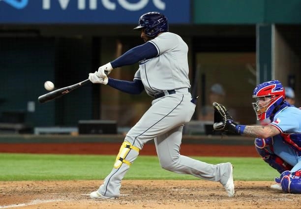 Yandy Diaz of the Tampa Bay Rays connects for a two run home run against the Texas Rangers at Globe Life Field on June 06, 2021 in Arlington, Texas.