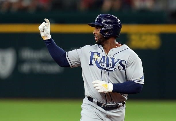 Yandy Diaz of the Tampa Bay Rays gestures as he runs the bases after a two-run home run against the Texas Rangers in the ninth inning at Globe Life...