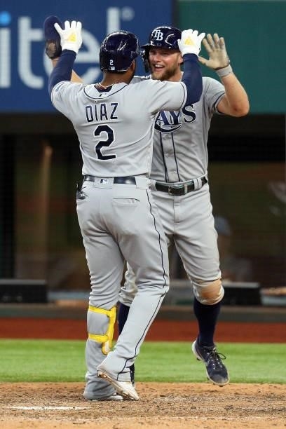 Yandy Diaz of the Tampa Bay Rays is greeted at home by Austin Meadows of the Tampa Bay Rays after a two-run home run against the Texas Rangers in the...