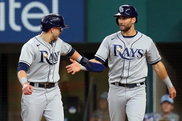 Mike Brosseau of the Tampa Bay Rays and Kevin Kiermaier of the Tampa Bay Rays celebrate after scoring against the Texas Rangers in the ninth at Globe...