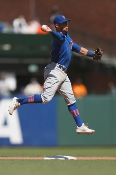 Eric Sogard of the Chicago Cubs gets the out at second base and throws to first base to turn a double play in the bottom of the eighth inning against...