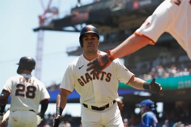 LaMonte Wade Jr. #31 of the San Francisco Giants celebrates with Alex Dickerson after hitting a solo home run in the bottom of the first inning...