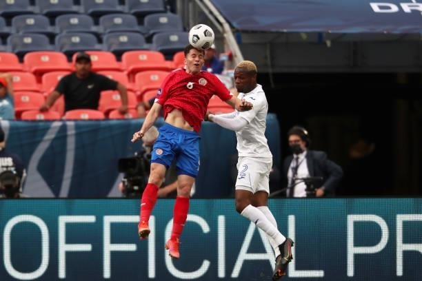 Bryan Ruiz of Costa Rica and Marcelo Pereira of Honduras head the ball during the CONCACAF Nations League Championship third place match between...