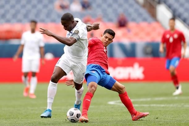 Maynor Figueroa of Honduras fights for control of the ball aganst Alonso Martinez of Costra Rica in the first half during the third place match of...