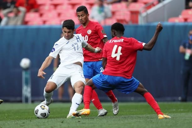 Jonathan Rubio of Honduras and Keysher Fuller of Costa Rica fight the ball during the CONCACAF Nations League Championship third place match between...