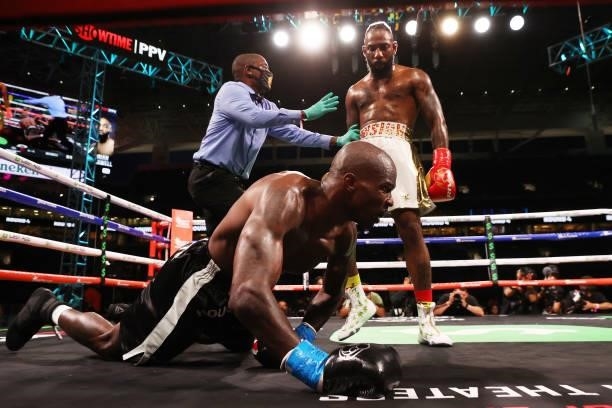 Chad Johnson is knocked down by Brian Maxwell during their contracted exhibition boxing match at Hard Rock Stadium on June 06, 2021 in Miami Gardens,...