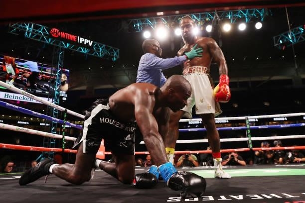 Chad Johnson is knocked down by Brian Maxwell during their contracted exhibition boxing match at Hard Rock Stadium on June 06, 2021 in Miami Gardens,...