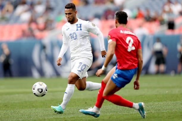 Alexander Lopez of Honduras advances the ball against Ariel Lassiter of Costra Rica in the second half during the third place match of the Finals of...