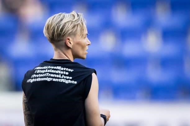Jessica Fishlock of OL Reign wears a tee shirt that says on the back #BlackLivesMattter #StopAsianHate #ProtectTransLives and #Fight4ImmigrantRights...