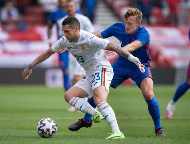 Nicolae Stanciu of Romania and James Ward-Prowse of England in action during the international friendly match between England and Romania at...