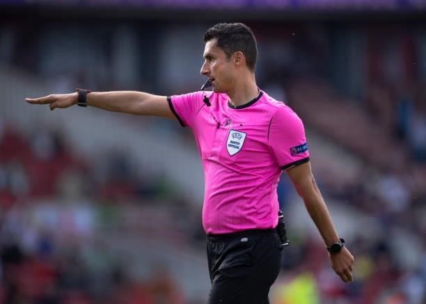 Referee Tiago Martins points to the penalty spot to award England their first penalty during the international friendly match between England and...