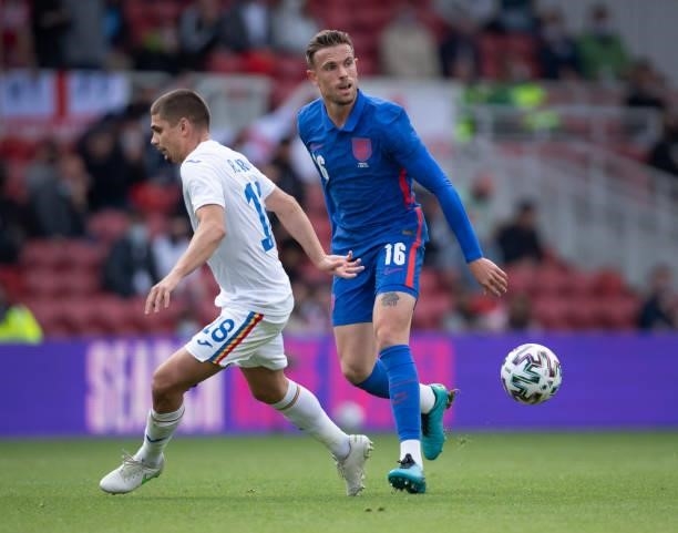 Jordan Henderson of England and Razvan Marin of Romania in action during the international friendly match between England and Romania at Riverside...
