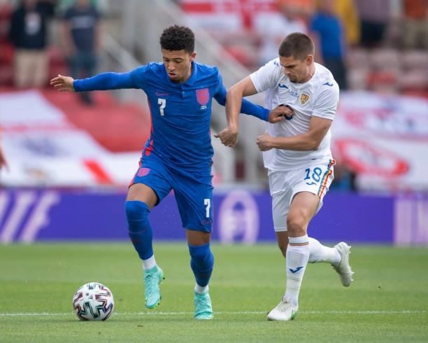 Jadon Sancho of England and Razvan Marin of Romania in action during the international friendly match between England and Romania at Riverside...