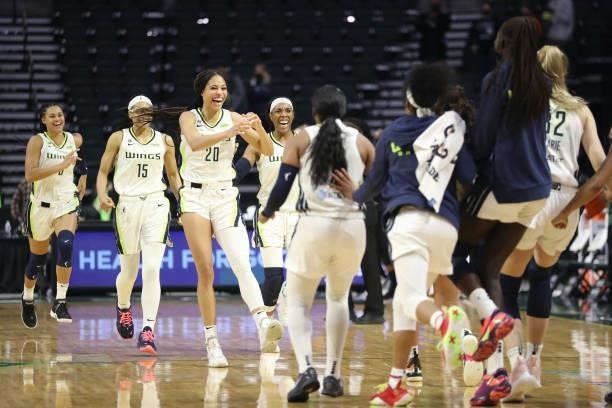 The Dallas Wings celebrate on the court after defeating the Seattle Storm 68-67 at Angel of the Winds Arena on June 06, 2021 in Everett, Washington....