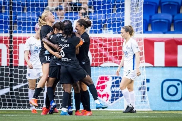 Ifeoma Onumonu of NJ/NY Gotham FC is congratulated by teammates for her goal in the first half of the match against OL Reign at Red Bull Arena on...