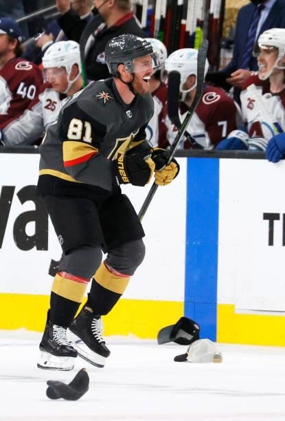 Jonathan Marchessault of the Vegas Golden Knights celebrates as he skates past hats thrown onto the ice by fans after he scored a third-period goal,...
