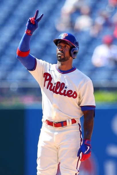 Andrew McCutchen of the Philadelphia Phillies gestures after he hit a double during the fifth inning of a game against the Washington Nationals at...