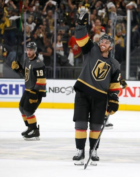 Reilly Smith and Jonathan Marchessault of the Vegas Golden Knights celebrate on the ice after the team's 5-1 victory over the Colorado Avalanche in...