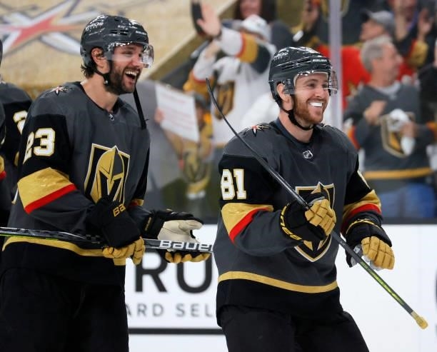 Alec Martinez and Jonathan Marchessault of the Vegas Golden Knights celebrate on the ice after the team's 5-1 victory over the Colorado Avalanche in...