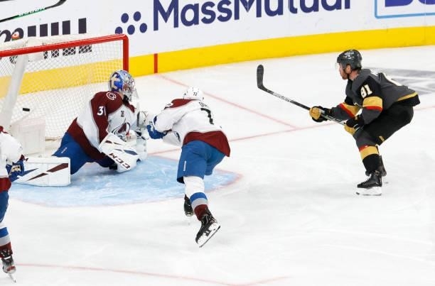 Jonathan Marchessault of the Vegas Golden Knights scores a third-period goal against Philipp Grubauer of the Colorado Avalanche for his third goal of...