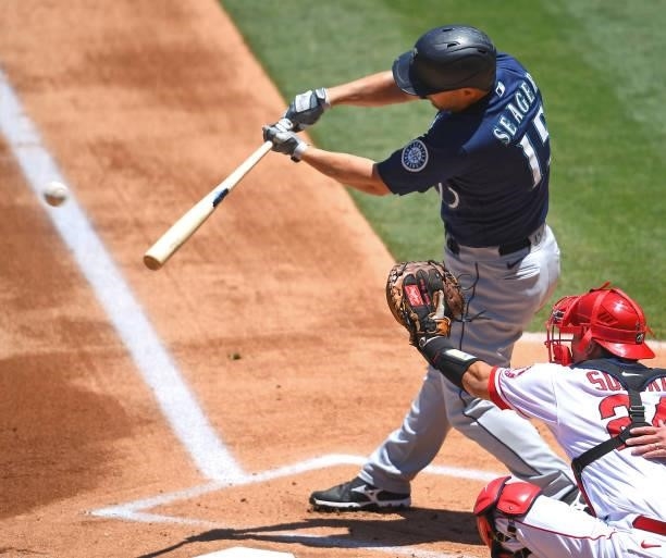 Kyle Seager of the Seattle Mariners singles in the game against the Los Angeles Angels at Angel Stadium of Anaheim on June 6, 2021 in Anaheim,...