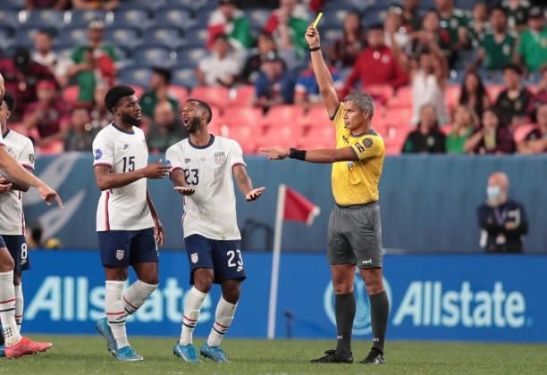 Kellyn Acosta of the United States reacts to being shown the yellow card during the CONCACAF Nations League Championship Final between the United...