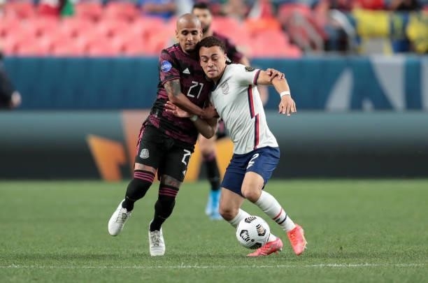 Sergino Dest of the United States battles with Carlos Rodríguez of Mexico during the CONCACAF Nations League Championship Final between the United...