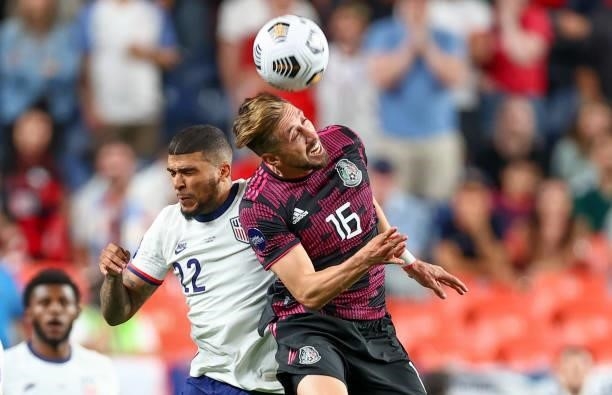 DeAndre Yedlin of the United States and Hector Herrera of Mexico battle during the CONCACAF Nations League Championship final at Mile High on June 6,...
