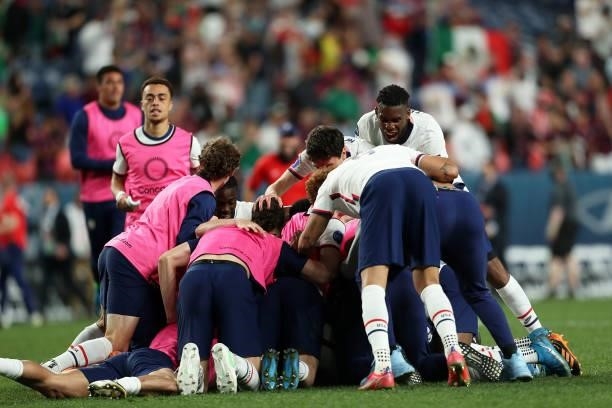 Players of United States celebrates after winning the CONCACAF Nations League Championship Final between United States and Mexico at Empower Field At...