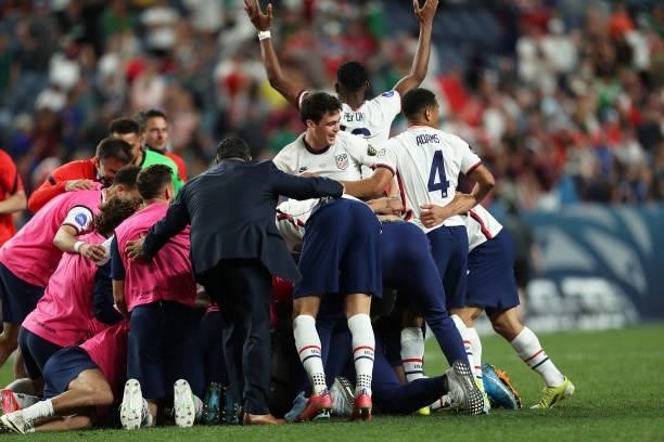 Players of United States celebrates after winning the CONCACAF Nations League Championship Final between United States and Mexico at Empower Field At...
