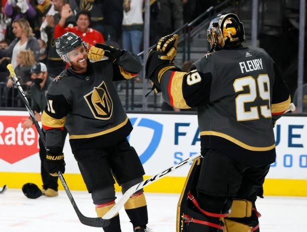 Jonathan Marchessault and Marc-Andre Fleury of the Vegas Golden Knights celebrate after Marchessault scored a third-period goal, his third goal of...