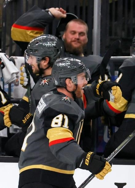 Robin Lehner of the Vegas Golden Knights takes his hat off to throw it on the ice as Jonathan Marchessault celebrates with teammates on the bench...