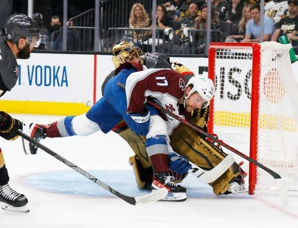Marc-Andre Fleury of the Vegas Golden Knights pushesTyson Jost of the Colorado Avalanche aside after blocking his shot in the first period in Game...