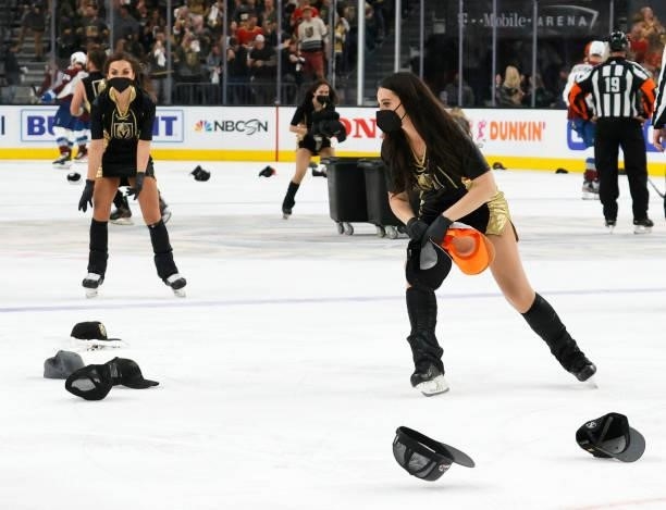 Members of the Knights Guard collect hats thrown on the ice after Jonathan Marchessault of the Vegas Golden Knights scored his third goal of the game...