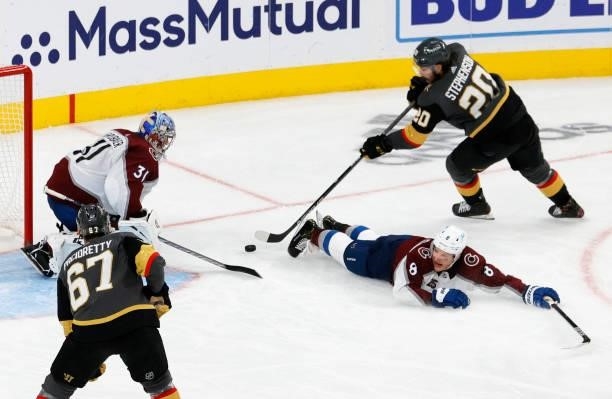 Philipp Grubauer of the Colorado Avalanche blocks a shot by Chandler Stephenson of the Vegas Golden Knights as Cale Makar of the Avalanche defends in...