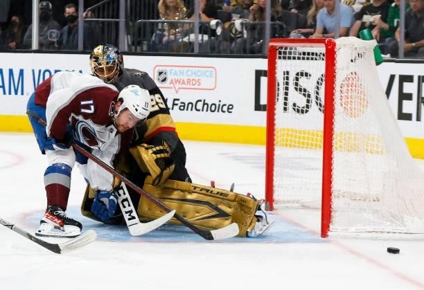 Marc-Andre Fleury of the Vegas Golden Knights pushes Tyson Jost of the Colorado Avalanche aside after blocking his shot in the first period in Game...