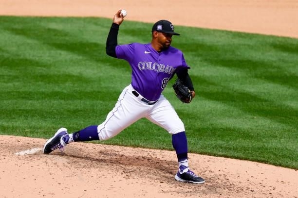 Relief pitcher Mychal Givens of the Colorado Rockies delivers to home plate during the seventh inning against the Oakland Athletics at Coors Field on...