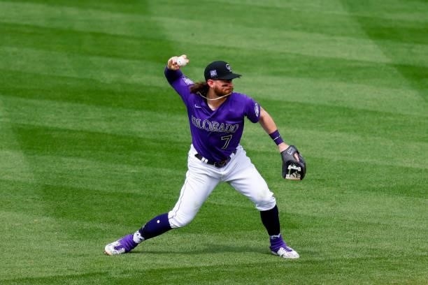 Shortstop Brendan Rodgers of the Colorado Rockies throws to first base during the seventh inning against the Oakland Athletics at Coors Field on June...