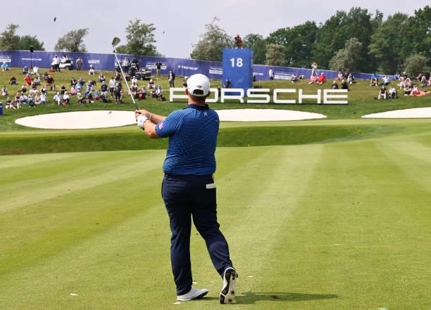 Marcus Armitage of England plays his third shot on the 18th hole during Day Three of The Porsche European Open at Green Eagle Golf Course on June 07,...