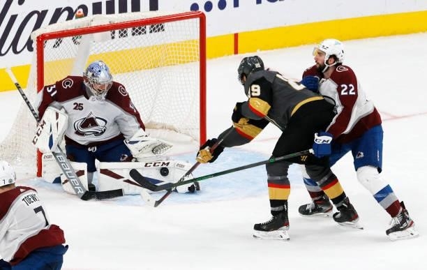 Philipp Grubauer of the Colorado Avalanche blocks a shot by Alex Tuch of the Vegas Golden Knights as Conor Timmins of the Avalanche defends in the...