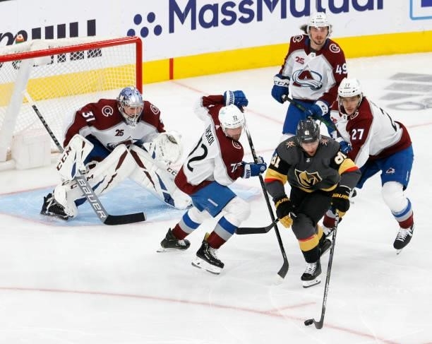 Jonathan Marchessault of the Vegas Golden Knights is defended by Philipp Grubauer, Joonas Donskoi, Samuel Girard and Ryan Graves of the Colorado...