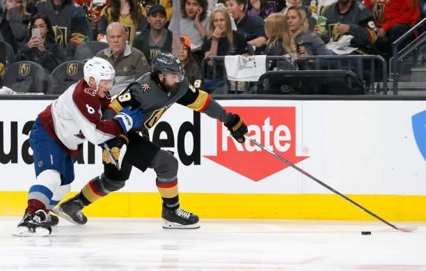 Alex Tuch of the Vegas Golden Knights skates with the puck against ahead of Cale Makar of the Colorado Avalanche in the second period in Game Four of...