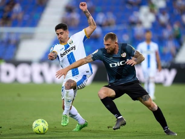 Miguel de la Fuente of CD Leganes competes for the ball with Esteban Saveljich during the Liga Smartbank Playoffs match between CD Leganes and Rayo...