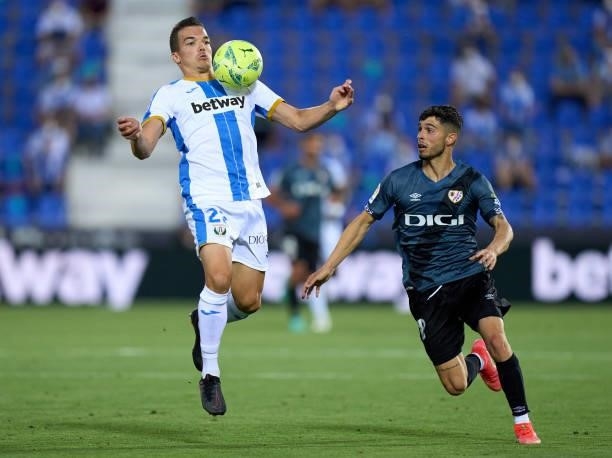 Kevin Bua of CD Leganes controls the ball under pressure from Mario Hernandez of Rayo Vallecano during the Liga Smartbank Playoffs match between CD...