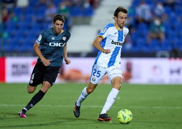 Ruben Pardo of CD Leganes is chased by Santi Comesana of Rayo Vallecano during the Liga Smartbank Playoffs match between CD Leganes and Rayo...