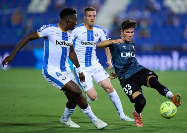 Fran Garcia of Rayo Vallecano is challenged by Kenneth Omeruo of CD Leganes during the Liga Smartbank Playoffs match between CD Leganes and Rayo...