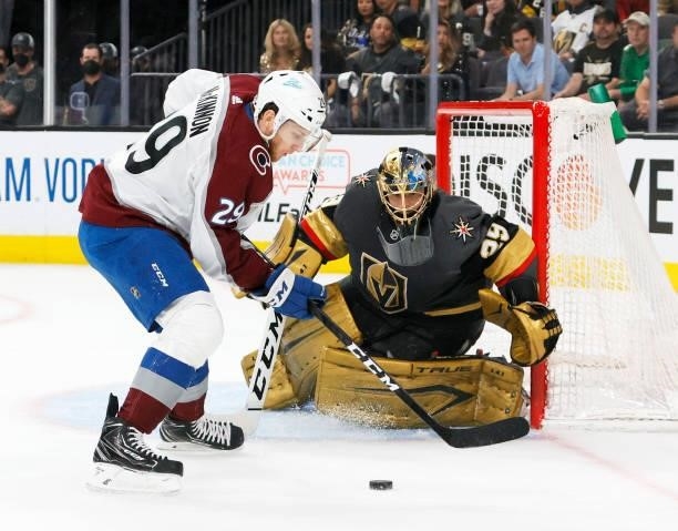 Marc-Andre Fleury of the Vegas Golden Knights defends the net against Nathan MacKinnon of the Colorado Avalanche in the first period in Game Four of...